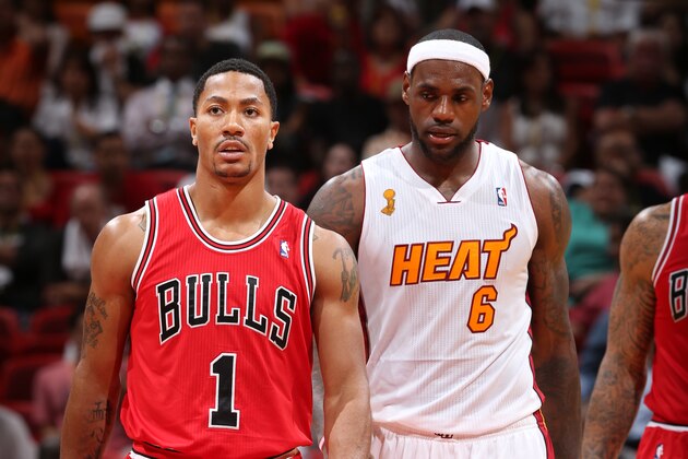 MIAMI, FL - OCTOBER 29: Derrick Rose #1 of the Chicago Bulls walks up the court against  LeBron James #6 of the Miami Heat on October 29, 2013 at AmericanAirlines Arena in Miami, Florida. NOTE TO USER: User expressly acknowledges and agrees that, by downloading and or using this photograph, User is consenting to the terms and conditions of the Getty Images License Agreement. Mandatory Copyright Notice: Copyright 2013 NBAE (Photo by Joe Murphy/NBAE via Getty Images)