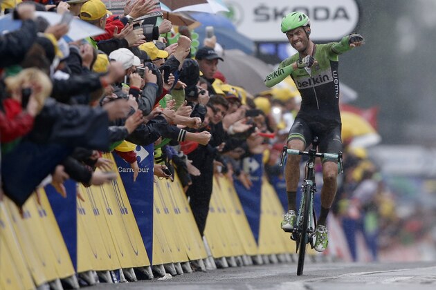 Netherland's Lars Boom celebrates as he crosses the finish line to win the fifth stage of the Tour de France cycling race over 155 kilometers (96.3 miles) with start in Ypres, Belgium, and finish in Arenberg, France, Wednesday, July 9, 2014. (AP Photo/Peter Dejong)