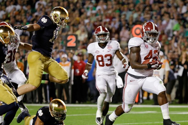 Alabama's Eddie Lacy (42) breaks away for a touchdown run during the first half of the BCS National Championship college football game against Notre Dame Monday, Jan. 7, 2013, in Miami. (AP Photo/David J. Phillip)