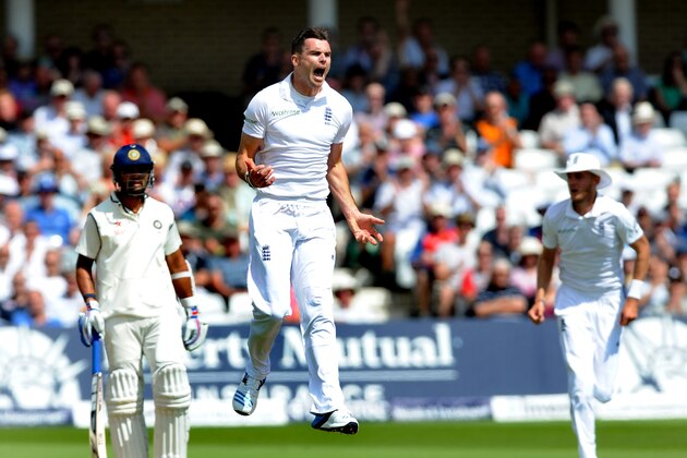 England's James Anderson celebrates after bowling India's Shikhar Dhawan caught by Matt Prior for 12 runs during day one of the first Test between England and India at Trent Bridge cricket ground, Nottingham, England, Wednesday July 9, 2014. (AP Photo/Rui Vieira)