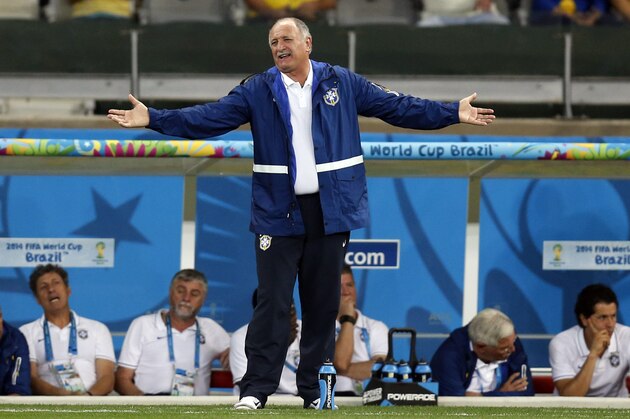 Brazil's coach Luiz Felipe Scolari spreads his arms as he watches the World Cup semifinal soccer match between Brazil and Germany at the Mineirao Stadium in Belo Horizonte, Brazil, Tuesday, July 8, 2014. (AP Photo/Frank Augstein)