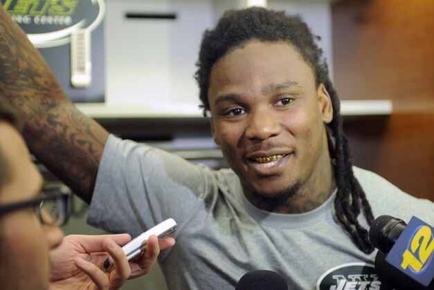 New York Jets NFL football running back Chris Johnson speaks to the media Thursday, May 22, 2014, in Florham Park, N.J. (AP Photo/Bill Kostroun)
