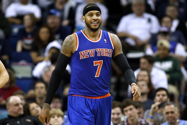 New York Knicks small forward Carmelo Anthony (7) smiles after scoring during the second half of an NBA basketball game against the New Orleans Pelicans in New Orleans, Wednesday, Feb. 19, 2014. The Knicks won 98-91. (AP Photo/Jonathan Bachman)
