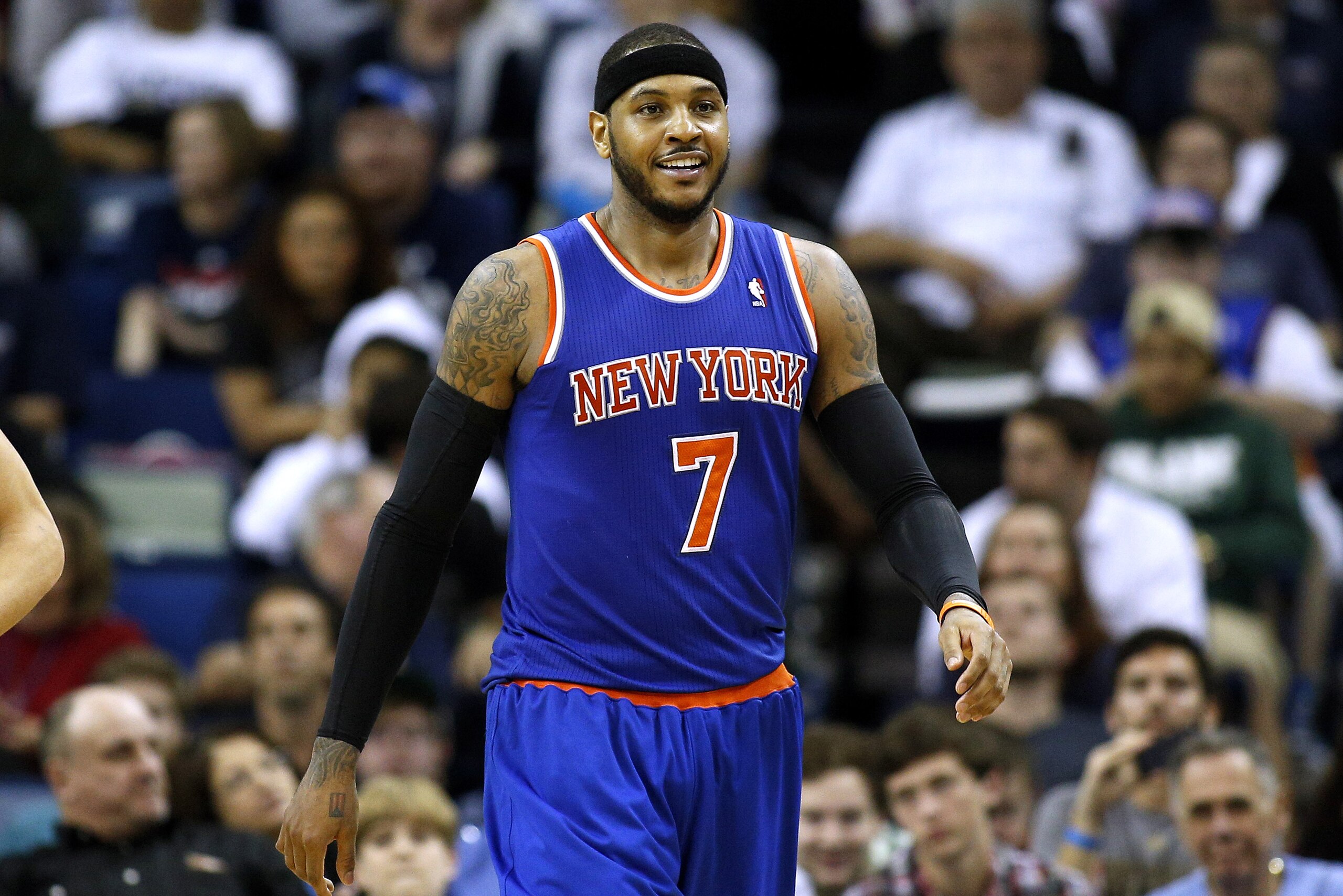 New York Knicks small forward Carmelo Anthony (7) smiles after scoring during the second half of an NBA basketball game against the New Orleans Pelicans in New Orleans, Wednesday, Feb. 19, 2014. The Knicks won 98-91. (AP Photo/Jonathan Bachman)