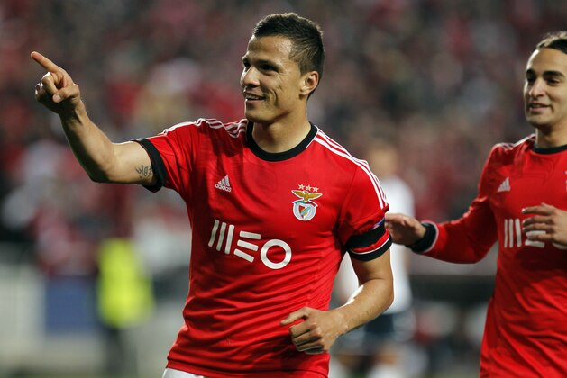 Benfica's Lima,left, celebrates with teammate Lazar Markovic, right, after scoring their side's second goal against Tottenham during the Europa League, round of 16, second leg soccer match between Benfica and Tottenham at Benfica's Luz stadium, in Lisbon, Thursday, March 20, 2014. Benfica won 5-3 on aggregate and advances to the next round. (AP Photo/Francisco Seco)