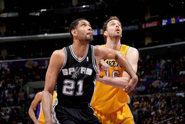 LOS ANGELES, CA - MARCH 19: Tim Duncan #21 of the San Antonio Spurs battles for position against Pau Gasol #16 of the Los Angeles Lakers at Staples Center on March 19, 2014 in Los Angeles, California. NOTE TO USER: User expressly acknowledges and agrees that, by downloading and/or using this Photograph, user is consenting to the terms and conditions of the Getty Images License Agreement. Mandatory Copyright Notice: Copyright 2014 NBAE (Photo by Andrew D. Bernstein/NBAE via Getty Images)