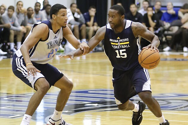 Indiana Pacers' Donald Sloan (15) drives around Oklahoma City Thunder's Andre Roberson, left, during an NBA summer league basketball game in Orlando, Fla., Wednesday, July 9, 2014. (AP Photo/John Raoux)