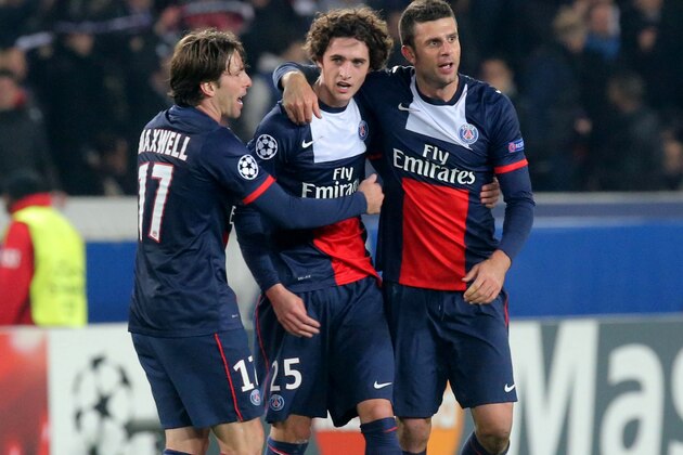 From left, Brazilian Maxwell Scherrer, Adrien Rabiot and Italian Thiago Motta celebrates their victory after the Group C Champions League soccer match between Paris Saint Germain and Olympiakos FC at the Parc des Princes stadium in Paris, Wednesday, Nov.27, 2013. PSG won 2-1.(AP Photo/Michel Euler)