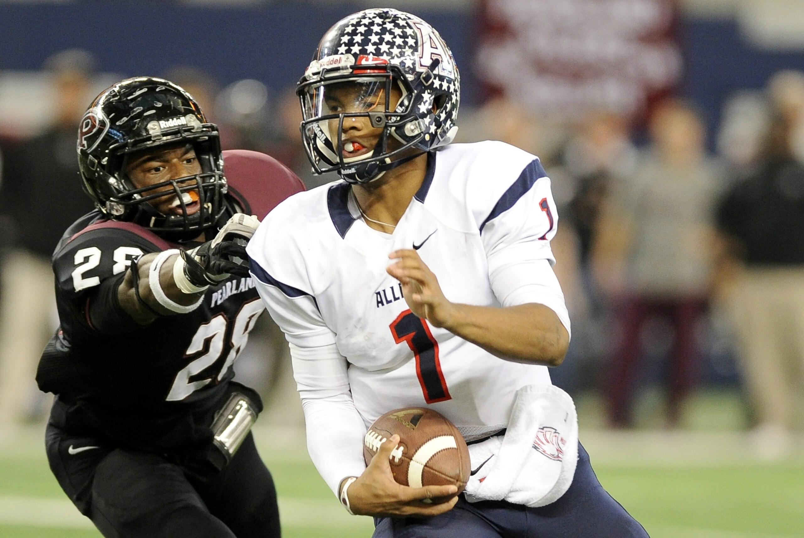 Allen quarterback Kyler Murray (1) runs upfield past Pearland Marlon Walls (28) in the first half during a UIL Class 5A Division I high school football championship game on Saturday Dec. 21, 2013, in Arlington, Texas. (AP Photo/Matt Strasen)