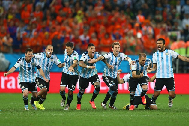 SAO PAULO, BRAZIL - JULY 09:  Lionel Messi, Pablo Zabaleta, Martin Demichelis, Marcos Rojo, Lucas Biglia, Javier Mascherano, Rodrigo Palacio and Ezequiel Garay of Argentina celebrate defeating the Netherlands in a shootout during the 2014 FIFA World Cup Brazil Semi Final match between the Netherlands and Argentina at Arena de Sao Paulo on July 9, 2014 in Sao Paulo, Brazil.  (Photo by Ronald Martinez/Getty Images)