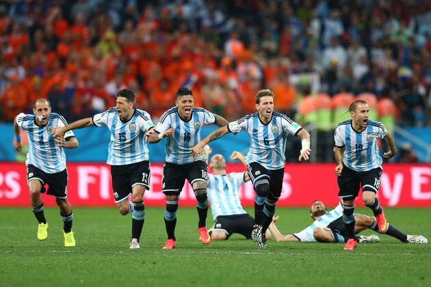 SAO PAULO, BRAZIL - JULY 09:  Lionel Messi, Pablo Zabaleta, Martin Demichelis, Marcos Rojo, Lucas Biglia, Javier Mascherano, Rodrigo Palacio and Ezequiel Garay of Argentina celebrate defeating the Netherlands in a shootout during the 2014 FIFA World Cup Brazil Semi Final match between the Netherlands and Argentina at Arena de Sao Paulo on July 9, 2014 in Sao Paulo, Brazil.  (Photo by Ronald Martinez/Getty Images)