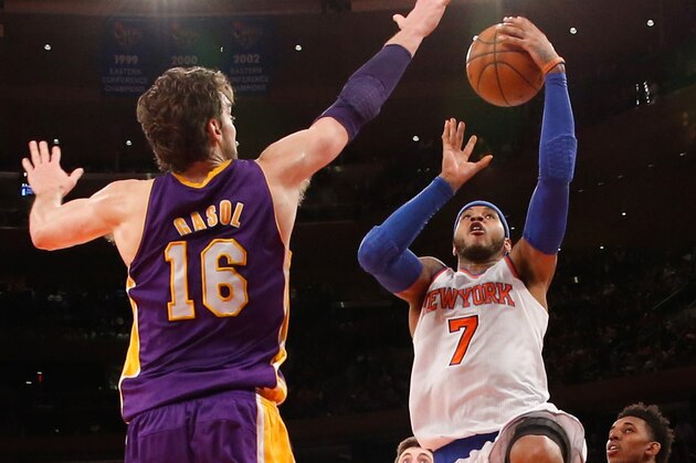 Jan 26, 2014; New York, NY, USA;  New York Knicks small forward Carmelo Anthony (7) shoots the ball as Los Angeles Lakers center Pau Gasol (16) defends during the fourth quarter at Madison Square Garden. The Knicks won 110-103. Mandatory Credit: Anthony Gruppuso-USA TODAY Sports