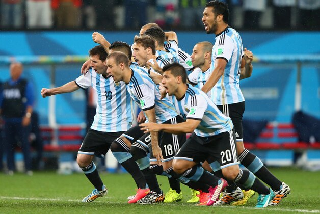 SAO PAULO, BRAZIL - JULY 09:  Lionel Messi, Pablo Zabaleta, Martin Demichelis, Marcos Rojo, Lucas Biglia, Javier Mascherano, Rodrigo Palacio, Ezequiel Garay and Sergio Aguero of Argentina celebrate defeating the Netherlands in a penalty shootout during the 2014 FIFA World Cup Brazil Semi Final match between the Netherlands and Argentina at Arena de Sao Paulo on July 9, 2014 in Sao Paulo, Brazil.  (Photo by Jamie Squire/Getty Images)
