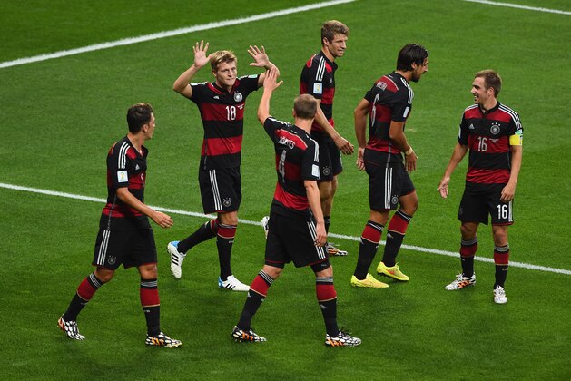 BELO HORIZONTE, BRAZIL - JULY 08:  Toni Kroos of Germany celebrates scoring his team's fourth goal and second of the game with teammates during the 2014 FIFA World Cup Brazil Semi Final match between Brazil and Germany at Estadio Mineirao on July 8, 2014 in Belo Horizonte, Brazil.  (Photo by Jamie McDonald/Getty Images)