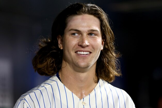 NEW YORK, NY - JULY 08:  Jacob deGrom #48 of the New York Mets looks on from the dugout in the seventh inning against the Atlanta Braves on July 8, 2014 at Citi Field in the Flushing neighborhood of the Queens borough of New York City.  (Photo by Elsa/Getty Images)