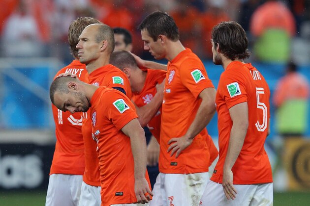 SAO PAULO, BRAZIL - JULY 09: Wesley Sneijder and Arjen Robben of the Netherlands react with teammates after being defeated in a penalty shootout by Argentina during the 2014 FIFA World Cup Brazil Semi Final match between the Netherlands and Argentina at Arena de Sao Paulo on July 9, 2014 in Sao Paulo, Brazil. (Photo by Dean Mouhtaropoulos/Getty Images) SAO PAULO, BRAZIL - JULY 09: Wesley Sneijder and Arjen Robben of the Netherlands react with teammates after being defeated in a penalty shootout by Argentina during the 2014 FIFA World Cup Brazil Semi Final match between the Netherlands and Argentina at Arena de Sao Paulo on July 9, 2014 in Sao Paulo, Brazil. (Photo by Dean Mouhtaropoulos/Getty Images)