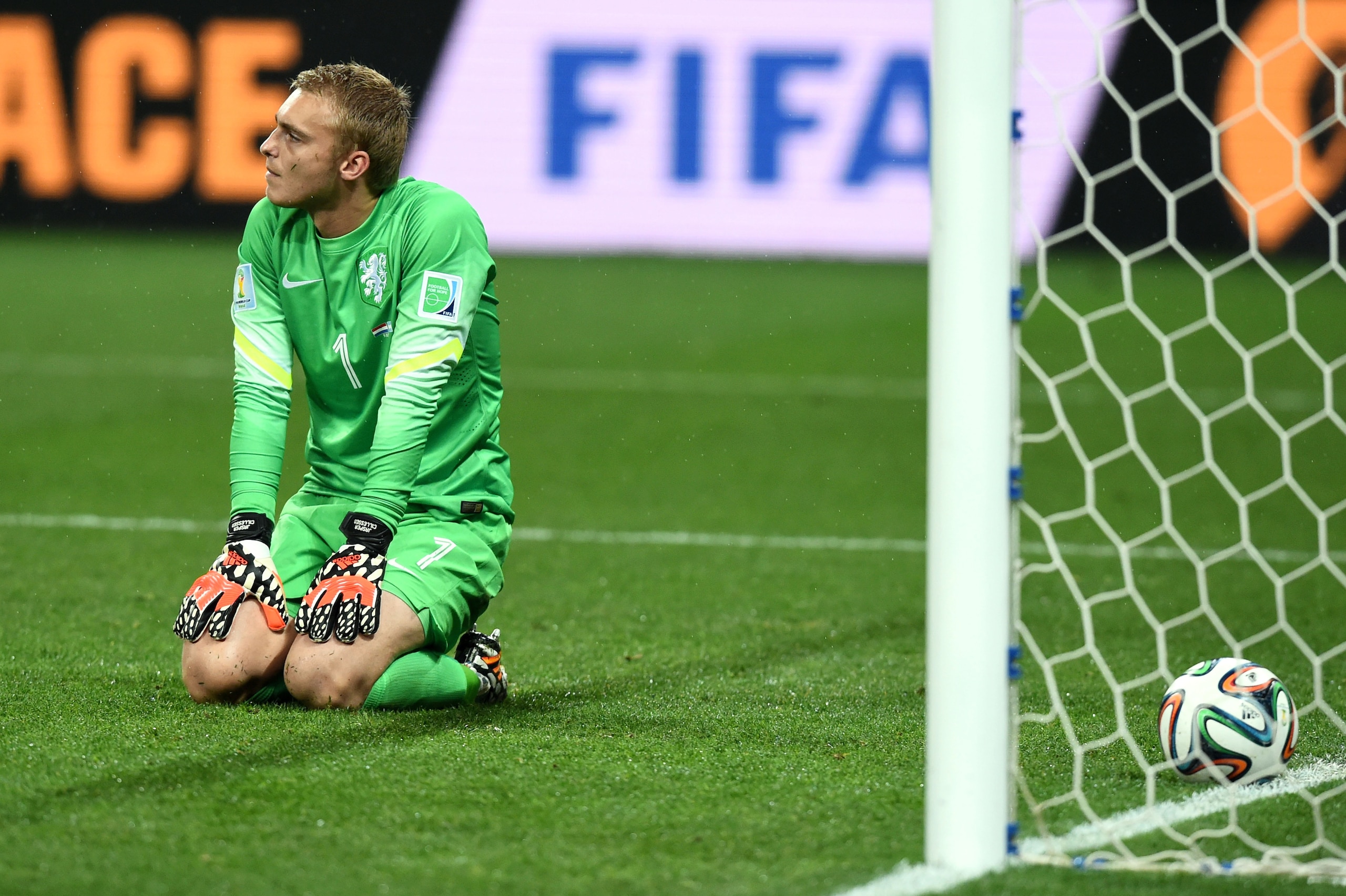 SAO PAULO, BRAZIL - JULY 09:  Jasper Cillessen of the Netherlands sits on the pitch after failing to save the penalty kick of Maxi Rodriguez of Argentina (not pictured) during the 2014 FIFA World Cup Brazil Semi Final match between the Netherlands and Argentina at Arena de Sao Paulo on July 9, 2014 in Sao Paulo, Brazil.  (Photo by Matthias Hangst/Getty Images)