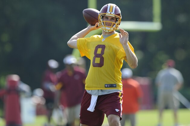 Washington Redskins quarterback Kirk Cousins (8) looks to pass during an NFL football minicamp, Tuesday, June 17, 2014, in Ashburn, Va. (AP Photo/Nick Wass)