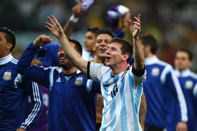 SAO PAULO, BRAZIL - JULY 09:  Lionel Messi of Argentina celebrates defeating the Netherlands in a shootout during the 2014 FIFA World Cup Brazil Semi Final match between the Netherlands and Argentina at Arena de Sao Paulo on July 9, 2014 in Sao Paulo, Brazil.  (Photo by Clive Rose/Getty Images)