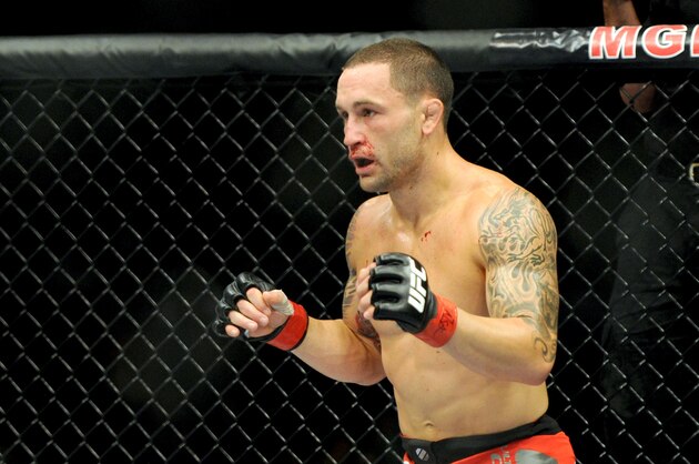 Jul 6, 2013; Las Vegas, NV, USA;  Frankie Edgar (red gloves) during his Featherweight Bout  against Charles Oliveira (not pictured) at the MGM Grand Garden Arena. Edgar won. Mandatory Credit: Jayne Kamin-Oncea-USA TODAY Sports