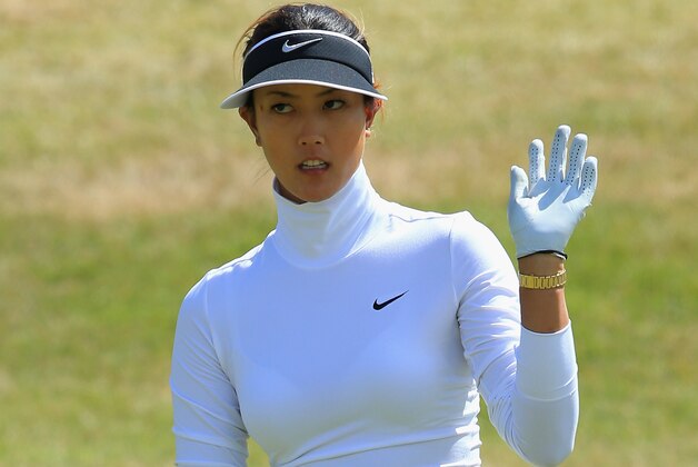 SOUTHPORT, ENGLAND - JULY 10:  Michelle Wie of the United States acknowledges the crowd during the first round of the Ricoh Women's British Open at Royal Birkdale on July 10, 2014 in Southport, England.  (Photo by David Cannon/Getty Images)