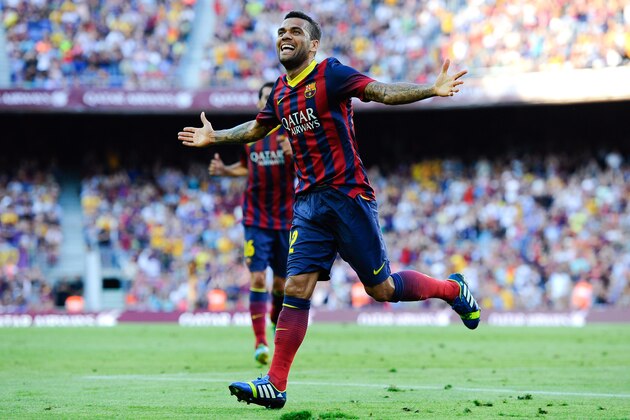 BARCELONA, SPAIN - AUGUST 18:  Dani Alves of FC Barcelona celebrates after scoring his team's third goal during the La Liga match between FC Barcelona and Levante UD at Camp Nou on August 18, 2013 in Barcelona, Spain.  (Photo by David Ramos/Getty Images)