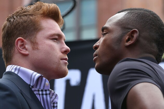 LOS ANGELES, CA - MAY 06:  Boxers Canelo Alvarez (L) and Erislandy Lara face off onstage prior to the press conference for Canelo Alvarez v Erislandy Lara on May 6, 2014 in Los Angeles, California.  (Photo by Victor Decolongon/Getty Images)