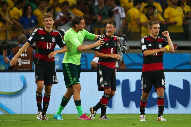BELO HORIZONTE, BRAZIL - JULY 08:  (L-R) Thomas Mueller, Manuel Neuer, Mesut Oezil and Philipp Lahm of Germany celebrate a 7-1 victory over Brazil  during the 2014 FIFA World Cup Brazil Semi Final match between Brazil and Germany at Estadio Mineirao on July 8, 2014 in Belo Horizonte, Brazil.  (Photo by Robert Cianflone/Getty Images)