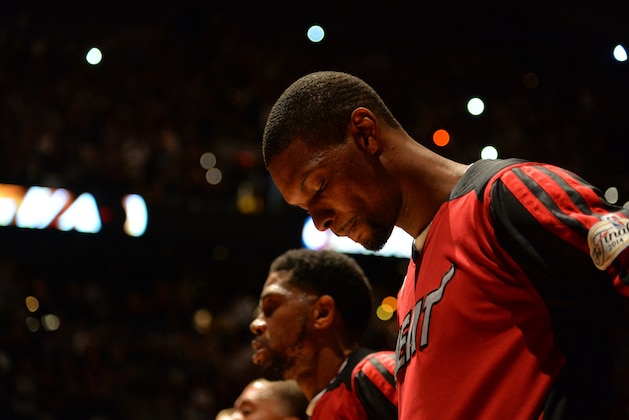 SAN ANTONIO, TX - JUNE 15: Chris Bosh #1 of the Miami Heat stands for the National Anthem before the game against the San Antonio Spurs in Game Five of the 2014 NBA Finals on June 15, 2014 at AT&T Center in San Antonio, Texas. NOTE TO USER: User expressly acknowledges and agrees that, by downloading and or using this photograph, User is consenting to the terms and conditions of the Getty Images License Agreement. Mandatory Copyright Notice: Copyright 2014 NBAE (Photo by Jesse D. Garrabrant/NBAE via Getty Images)
