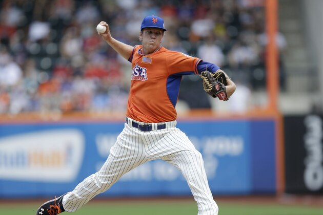 United States' starting pitcher Noah Syndergaard delivers in the MLB All-Star Futures baseball game against  the World Team on Sunday, July 14, 2013 in New York. (AP Photo/Kathy Willens)