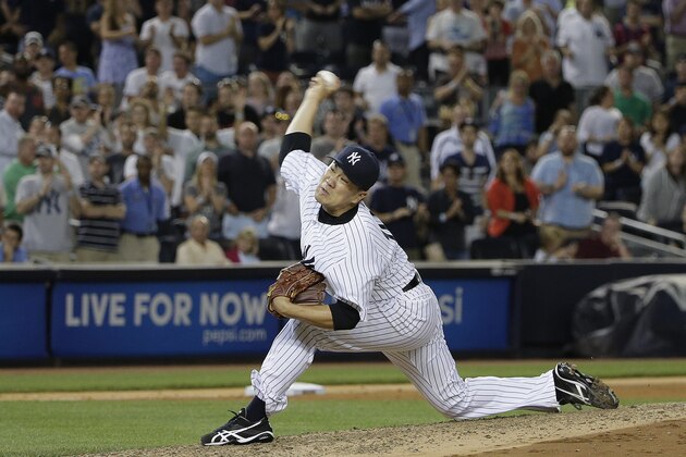 New York Yankees pitcher Masahiro Tanaka delivers to Boston Red Sox's Mike Napoli in the ninth inning of a baseball game, Saturday, June 28, 2014, in New York. Napoli hit a solo home run to right field on the pitch and the Red Sox won 2-1. (AP Photo/Julie Jacobson)