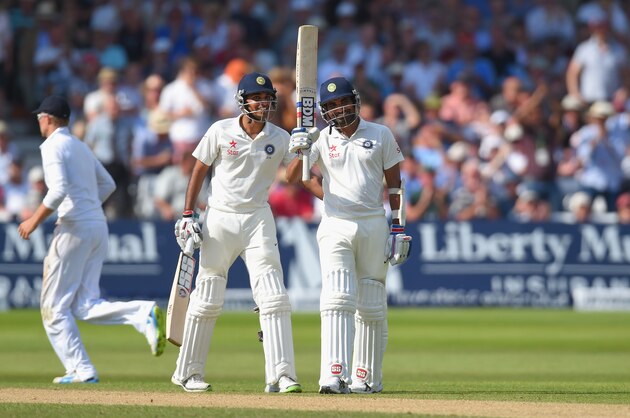 NOTTINGHAM, ENGLAND - JULY 10: India batsman Mohammed Shami (r) and partner Bhuvneshwar Kumar celebrate their 100 partnership for the last wicket and Shami's 50 which he had reached with a straight six during day two of the 1st Investec Test Match between England and India at Trent Bridge on July 10, 2014 in Nottingham, England. (Photo by Stu Forster/Getty Images) NOTTINGHAM, ENGLAND - JULY 10: India batsman Mohammed Shami (r) and partner Bhuvneshwar Kumar celebrate their 100 partnership for the last wicket and Shami's 50 which he had reached with a straight six during day two of the 1st Investec Test Match between England and India at Trent Bridge on July 10, 2014 in Nottingham, England. (Photo by Stu Forster/Getty Images)