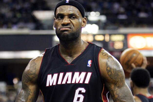 FILE - In this Dec. 27, 2013 file photo, Miami Heat forward LeBron James reacts after scoring and drawing a foul against the Sacramento Kings during the first half of an NBA basketball game, in Sacramento, Calif. The wait continues for the next decision. At stake for LeBron James: Where he plays for the next few seasons, and which fan base _ the already-scorned one in Cleveland or the panicked one in Miami _ will undoubtedly feel alienated by whatever choice his latest foray into free agency leads him to make. (AP Photo/Steve Yeater, File)
