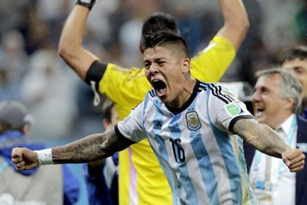 Argentina's Marcos Rojo celebrates after Argentina defeated the Netherlands 4-2 in a penalty shootout after a 0-0 tie after extra time to advance to the finals during the World Cup semifinal soccer match between the Netherlands and Argentina at the Itaquerao Stadium in Sao Paulo Brazil, Wednesday, July 9, 2014. (AP Photo/Victor R. Caivano)