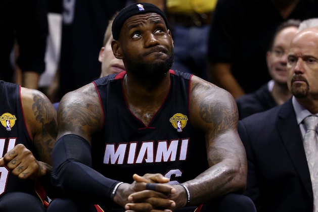 SAN ANTONIO, TX - JUNE 15:  LeBron James #6 of the Miami Heat reacts on the bench against the San Antonio Spurs during Game Five of the 2014 NBA Finals at the AT&T Center on June 15, 2014 in San Antonio, Texas. NOTE TO USER: User expressly acknowledges and agrees that, by downloading and or using this photograph, User is consenting to the terms and conditions of the Getty Images License Agreement.  (Photo by Andy Lyons/Getty Images)