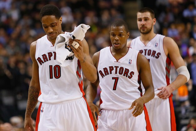 Apr 9, 2014; Toronto, Ontario, CAN; Toronto Raptors guard DeMar DeRozan (10) is followed by guard Kyle Lowry (7) and center Jonas Valanciunas (17) as he comes off the court bleeding during the fourth quarter against the Philadelphia 76ers at the Air Canada Centre. Toronto defeated Philadelphia 125-114. Mandatory Credit: John E. Sokolowski-USA TODAY Sports Apr 9, 2014; Toronto, Ontario, CAN; Toronto Raptors guard DeMar DeRozan (10) is followed by guard Kyle Lowry (7) and center Jonas Valanciunas (17) as he comes off the court bleeding during the fourth quarter against the Philadelphia 76ers at the Air Canada Centre. Toronto defeated Philadelphia 125-114. Mandatory Credit: John E. Sokolowski-USA TODAY Sports