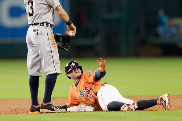 HOUSTON, TX - JUNE 27: Jose Altuve #27 of the Houston Astros calls for time after stealing second base in the first inning as Ian Kinsler #3 of the Detroit Tigers is late on the tag at Minute Maid Park on June 27, 2014 in Houston, Texas.  (Photo by Bob Levey/Getty Images)