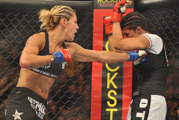 SAN JOSE, CA - AUGUST 15:  Cris Cyborg (L) battles Gina Carano during their Middleweight Championship fight at Stikeforce: Carano vs. Cyborg on August 15, 2009 in San Jose, California.  (Photo by Jon Kopaloff/Getty Images)