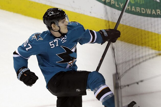 San Jose Sharks' Tommy Wingels (57) celebrates his game-winning goal against the Dallas Stars during overtime of an NHL hockey game on Wednesday, Feb. 5, 2014, in San Jose, Calif. San Jose won 2-1. (AP Photo/Marcio Jose Sanchez)