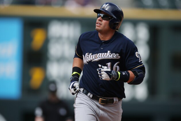 Milwaukee Brewers' Aramis Ramirez circles the bases after hitting a solo home run against the Colorado Rockies in the fifth inning of a baseball game in Denver on Saturday, June 21, 2014. (AP Photo/David Zalubowski)