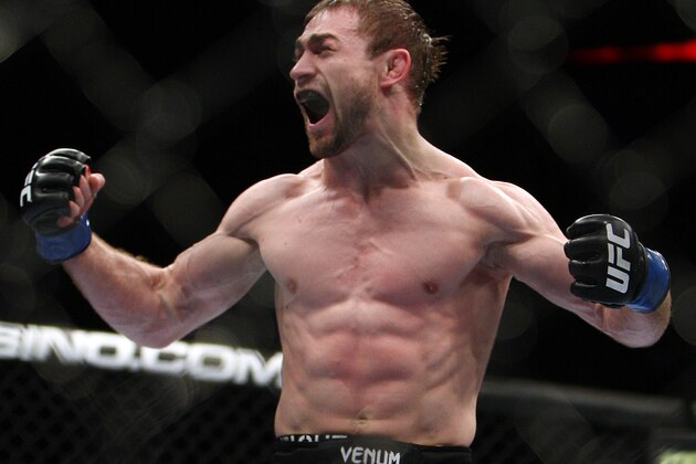 Ali Bagautinov, of Russia, reacts after defeating John Lineker, of Brazil, during the third round of a UFC 169 flyweight mixed martial arts bout in Newark, N.J., Saturday, Feb. 1, 2014. Bagautinov won by unanimous decision. (AP Photo/Tim Larsen)