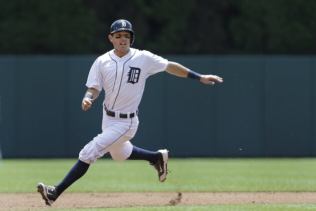 Detroit Tigers' Ian Kinsler rounds second base against the Los Angeles Dodgers in the first inning of a baseball game in Detroit, Wednesday, July 9, 2014. (AP Photo/Paul Sancya)