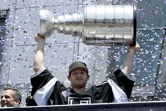 LOS ANGELES CA-JUNE 16: Jonathan Quick #32 of the Los Angeles Kings holds up the Stanley Cup during Los Angeles Kings victory parade and rally June 16, 2014, in Los Angeles, California. (Photo by Kevork Djansezian/Getty Images)