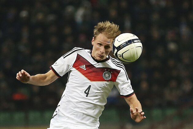 Germany defender Benedikt Howedes stops the ball during a friendly soccer match between Italy and Germany at the San Siro  stadium in Milan, Italy, Friday, Nov. 15, 2013. (AP Photo/Antonio Calanni)