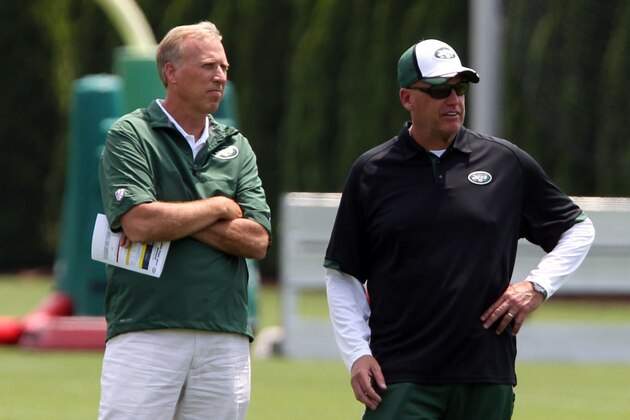 Jun 17, 2014; Florham Park, NJ, USA; New York Jets general manager John Idzik (left) and coach Rex Ryan during minicamp at Atlantic Health Training Center. Mandatory Credit: Noah K. Murray-USA TODAY Sports