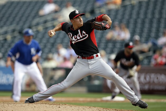 Cincinnati Reds' Robert Stephenson delivers to the Kansas City Royals in the fifth inning of a spring training baseball game, Tuesday, March 4, 2014, in Surprise, Ariz. (AP Photo/Tony Gutierrez)