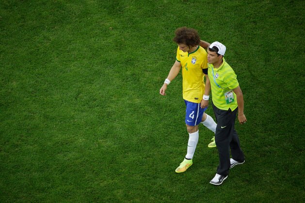 BELO HORIZONTE, BRAZIL - JULY 08:  Thiago Silva of Brazil (R) consoles David Luiz after being defeated by Germany 7-1 during the 2014 FIFA World Cup Brazil Semi Final match between Brazil and Germany at Estadio Mineirao on July 8, 2014 in Belo Horizonte, Brazil.  (Photo by Pool/Getty Images)