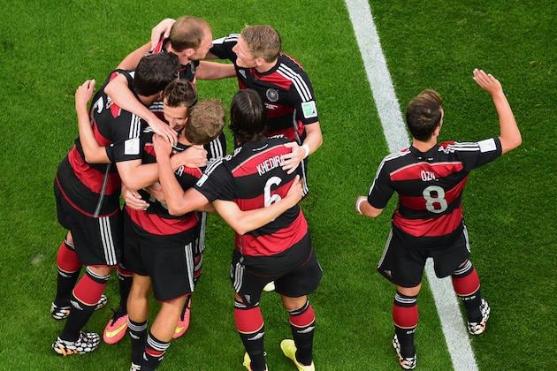 Germany players celebrate after Thomas Mueller scored his side's first goal during the World Cup semifinal soccer match between Brazil and Germany at the Mineirao Stadium in Belo Horizonte, Brazil, Tuesday, July 8, 2014. (AP Photo/Francois Xavier Marit, Pool)