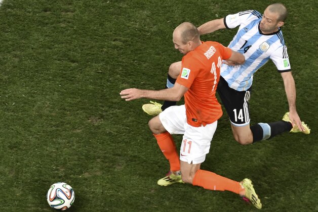 Netherlands' Arjen Robben (11) is challenged by Argentina's Javier Mascherano (14) during the World Cup semifinal soccer match between the Netherlands and Argentina at the Itaquerao Stadium in Sao Paulo, Brazil, Wednesday, July 9, 2014. (AP Photo/Francois Xavier Marit, Pool)