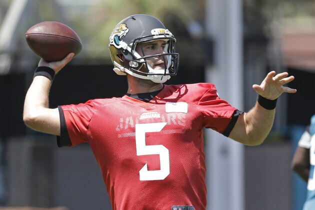 Jacksonville Jaguars quarterback Blake Bortles (5) throws a pass during an NFL organized team activities football practice in  in Jacksonville, Fla., Tuesday, June 3, 2014. (AP Photo/John Raoux)